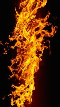 Dramatic red, orange, yellow flame and smoke rising against a dark backgrou.. Фото