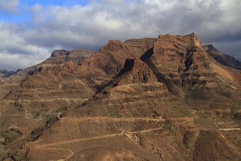 Dramatic red rock mountains gran canaria landscape Stock Photos