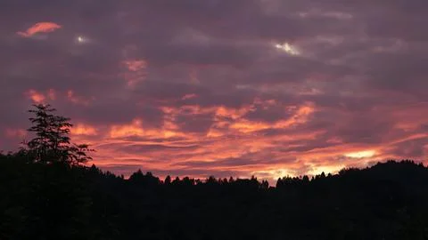 Dramatic red sunset in the mountains Stock Photos