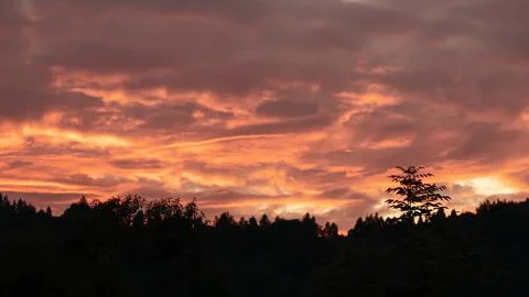 Dramatic red sunset in the mountains Stock Photos