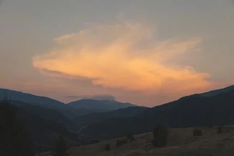 Dramatic red sunset in the mountains Stock Photos