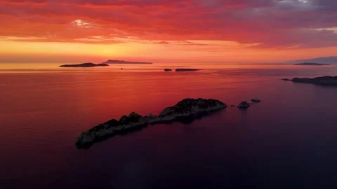 Dramatic red sunset over Mathraki and Diapontia Islands in Greece Stock Footage 342135082