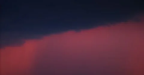 Dramatic red sunset sky featuring heavy dark raHeavy rain clouds rolling in Stock Footage 341341896