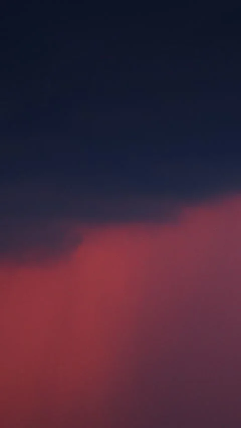 Dramatic red sunset sky featuring heavy dark raHeavy rain clouds rolling in Видео 347021387