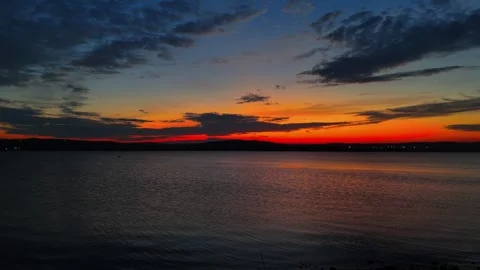 Dramatic Red Sunset Sky over Sea – 4K Aerial Drone Footage Stock Footage 319792208