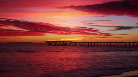 Dramatic Red Sunset Sky Over Ocean Pier with Burning Clouds Silhouette Stock Footage 332138181