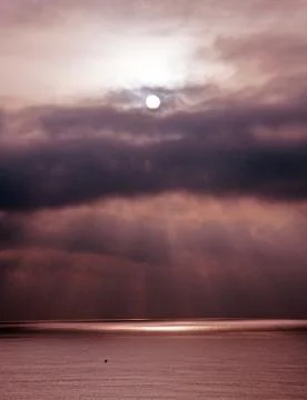Dramatic reddish skies with sun Stock-Fotos