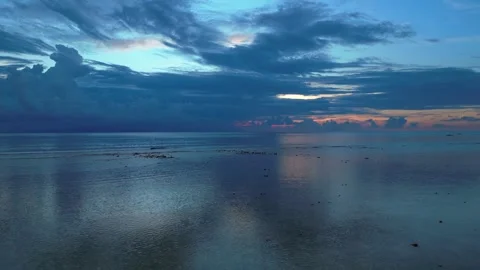 Dramatic Reflecting cloudy sky over calm ocean waters. Unbelievable aerial view Stock Footage 340794260