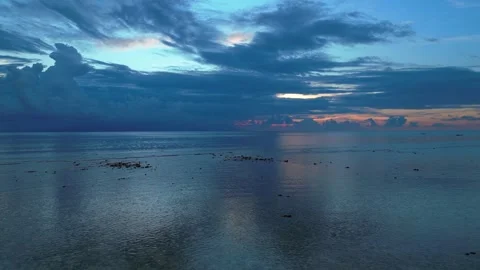Dramatic Reflecting cloudy sky over calm ocean waters. Spectacular aerial view Stock Footage 340794325