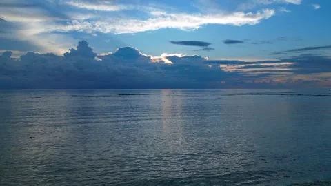 Dramatic Reflecting cloudy sky over calm ocean waters. Great aerial view drone Stock Footage 340794457