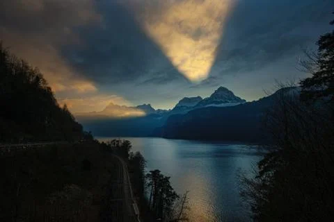 Dramatic reflection in the sky and clouds during sunset at lake Stock Photos