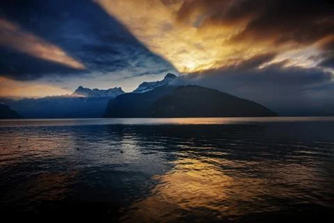 Dramatic reflection in the sky and clouds during sunset at lake Stock-Fotos