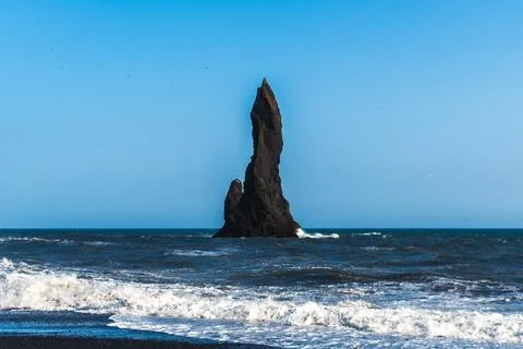 The dramatic Reynisfjara Beach features black volcanic sands and towering b.. Stock Photos