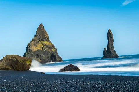The dramatic Reynisfjara Beach features black volcanic sands and towering b.. Stock Photos