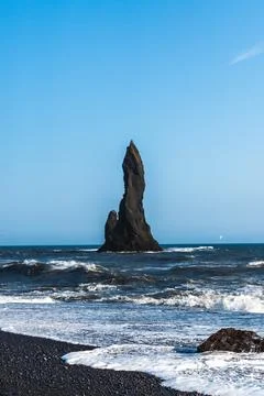 The dramatic Reynisfjara Beach features black volcanic sands and towering b.. Fotos de archivo