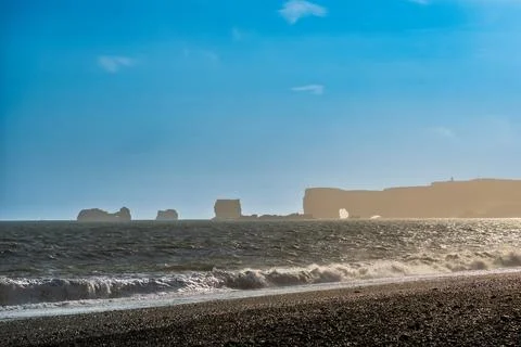 The dramatic Reynisfjara Beach features black volcanic sands and towering b.. Fotos de archivo