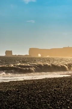 The dramatic Reynisfjara Beach features black volcanic sands and towering b.. Fotos de archivo