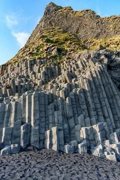 The dramatic Reynisfjara Beach features black volcanic sands and towering b.. Fotos de archivo