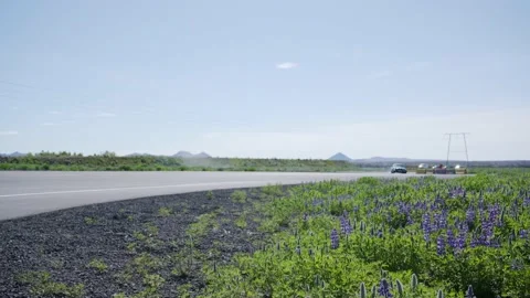 Dramatic roadside view of fast dark sedan car smoking tires drifting Stock Footage 132478879