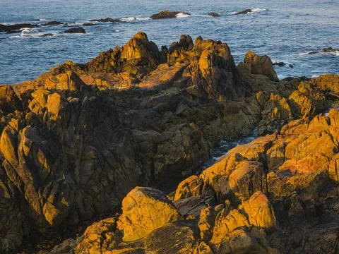 Dramatic Rock Formations and Ocean View at Sunrise, Praia Azul, Portugal Stock Photos