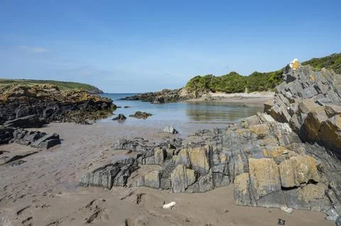 Dramatic rock formations on Angle Bay beach Stock Photos