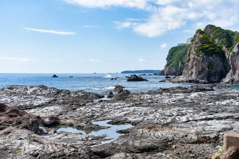 Dramatic rock formations on the coast of Pacific Ocean in Nachikatsuura. Stock Photos
