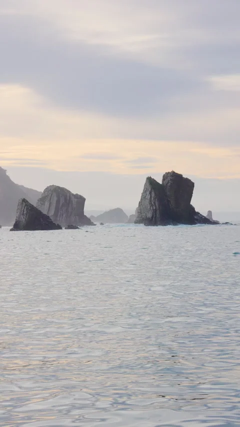Dramatic Rock Formations Emerging from the sea at Silence Beach, Asturias, Spain Stock Footage 302296727