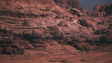 Dramatic rock formations in a remote desert landscape during twilight Stock Illustration