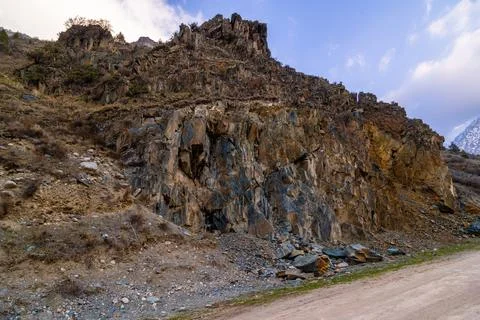 Dramatic rock sedimentary formation in serene mountainous Kyrgyzstan Fotos Stock