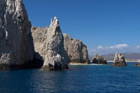 Dramatic rocks off the coast of cabo san lucas Stock Photos
