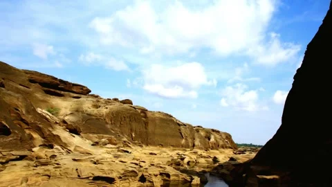 Dramatic Rocky Canyon Landscape Under Blue Sky with Clouds Video stock 310818087
