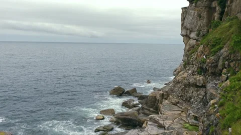 Dramatic Rocky Cliffs and Atlantic Ocean Coastline in Northern Spain Under C Stock Footage 339681080