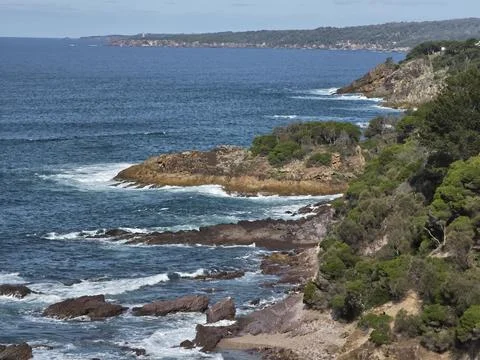 Dramatic Rocky Coastline with Ocean Waves Stock Photos