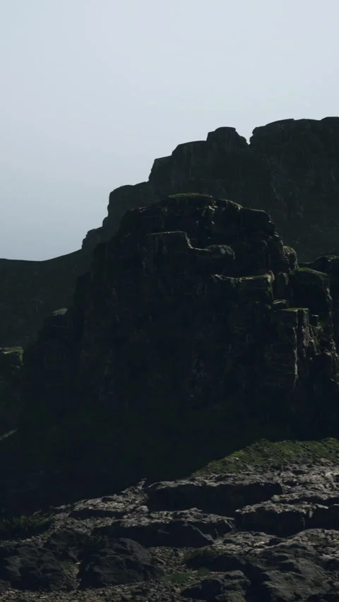 Dramatic rocky landscape under clear sky at dawn with soft lighting effects Stock Footage 327779578