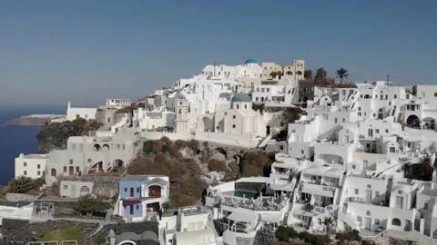 Dramatic rotating aerial of Santorini architecture and cliff top view Stock Footage 155037863
