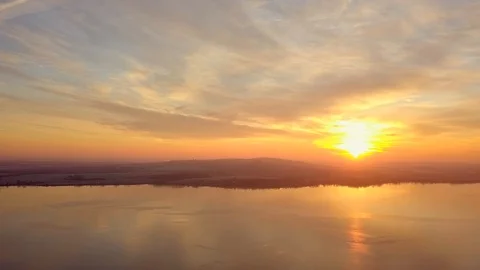 Dramatic scene of beautiful sunrise over a calm lake. Stock Footage 101519980