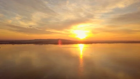 Dramatic scene of beautiful sunrise over a calm lake. Stock Footage 101520062