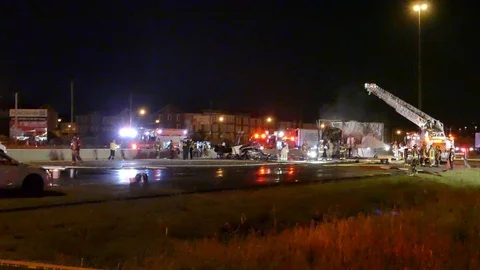 Dramatic scene of firemen putting out truck fire at crash - 24fps 1080p Stock Footage 91603234