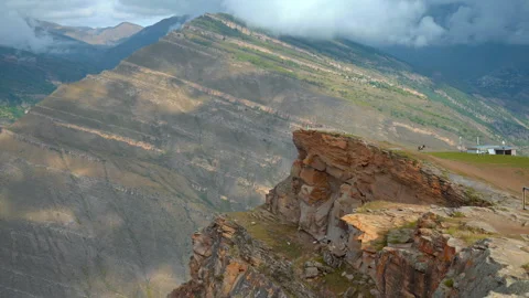 Dramatic Scene Of Paraglider Preparing On Precipice Overlooking Valleys And 스톡 동영상 327452155