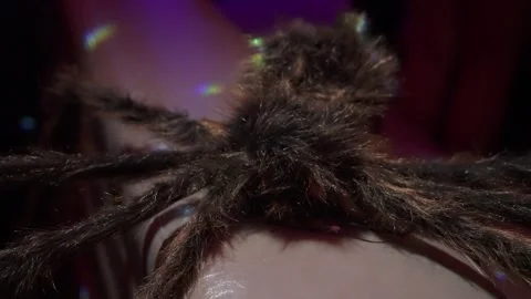 Dramatic Scene With Spider On Head, Tarantula Perched On Forehead Under Vibrant Stock Footage 323772751