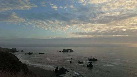 Dramatic Sea Arch and Sea Stacks on the Sonoma Coast at Sunset Stock Footage 320356337