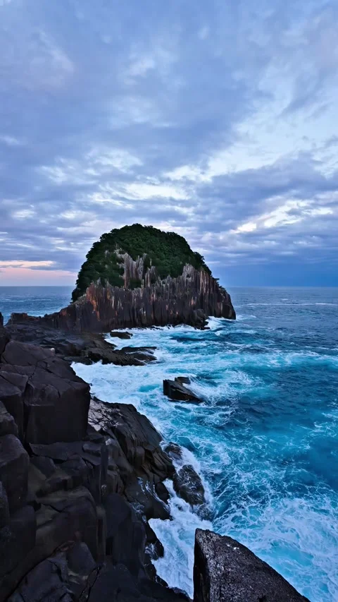 Dramatic Sea Cliff and Island Scene Under Moody Cloudy Sky (Vertical) Stock-Footage 337724443