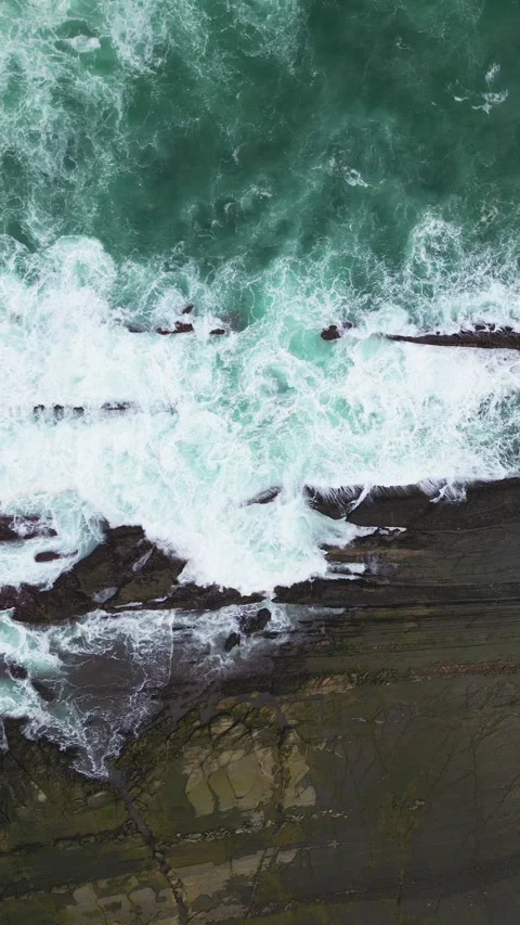 Dramatic Sea Foam Over Reef Rocks Stock Footage 329059359