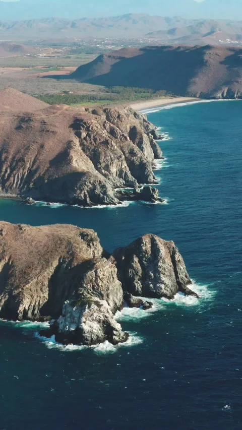 Dramatic Sea Stacks Along Rugged Baja Coastline, Mexico Stock Footage 345350652
