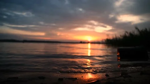 Dramatic sea sunrise. Burning sky and shining golden waves. Stock Footage 156423104
