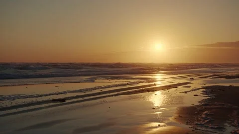 Dramatic sea sunrise. Burning sky and shining golden waves. Stock-Footage 157587589