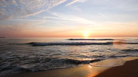 Dramatic sea sunrise. Burning sky and shining golden waves. Stock Footage 163612693