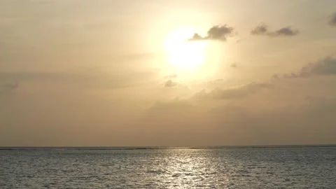 Dramatic sea sunrise. Burning sky and shining golden waves. Sun reflecting on Stock Footage 172343579