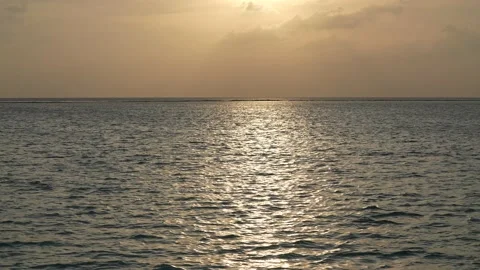 Dramatic sea sunrise. Burning sky and shining golden waves. Video stock 201062484
