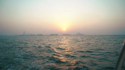Dramatic sea sunrise. Burning sky and shining golden waves. View from boat Stock Footage 220720673